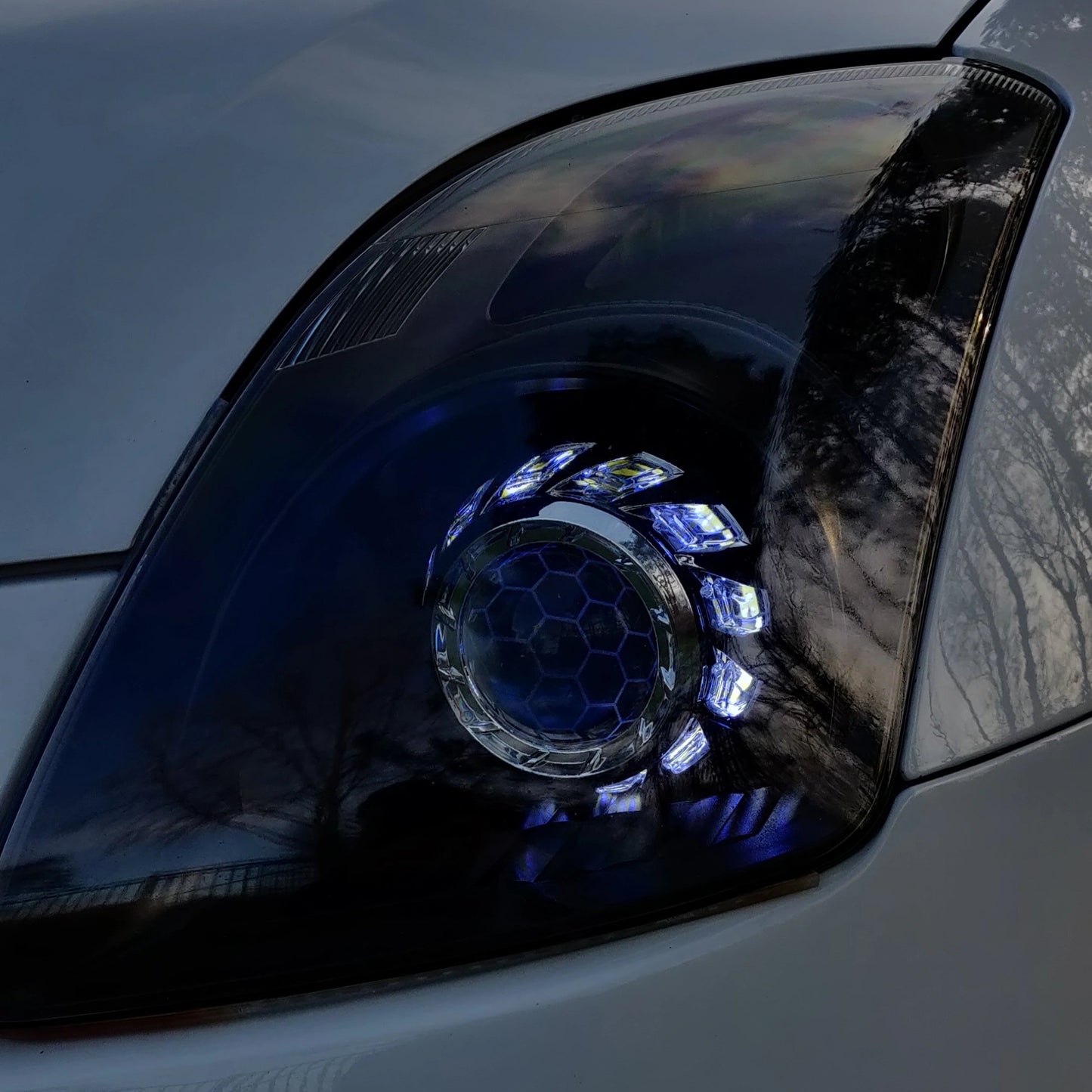 Swift custom headlight close up in chrome