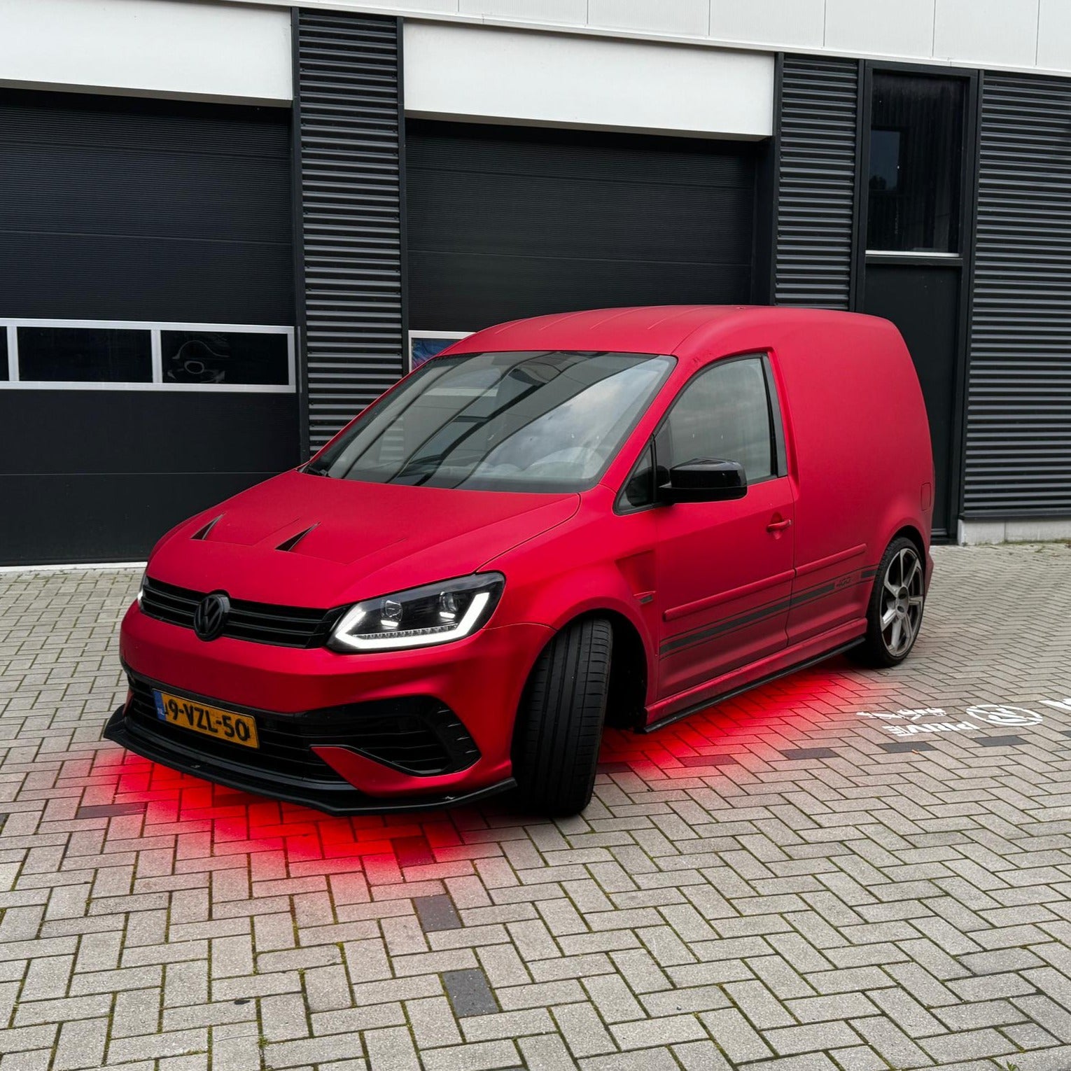 A Caddy with red underglow from Retroglow